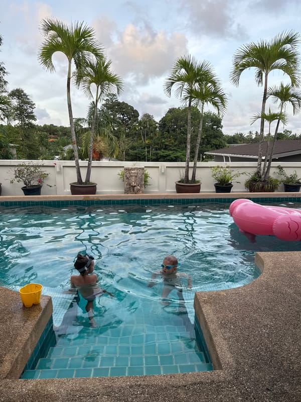 Child swims with inflatable flamingo in Rawai pool