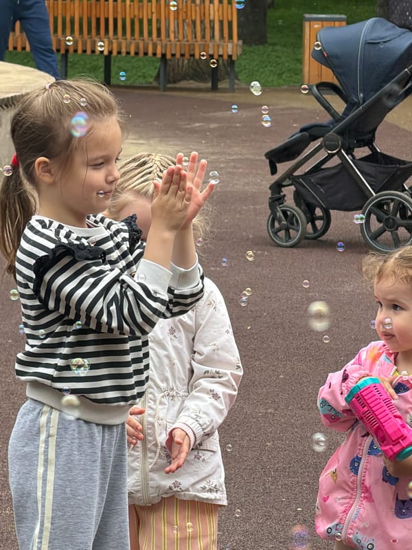 Young girls play with bubbles at Saratov playground
