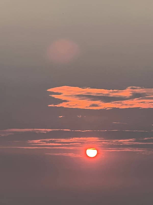 Sunset over a calm lakeside in rural Novopichugovo, Russia