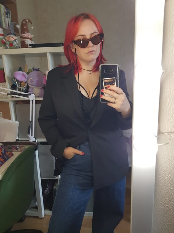 Mirror selfie and close-up of a bold, accessorized look.