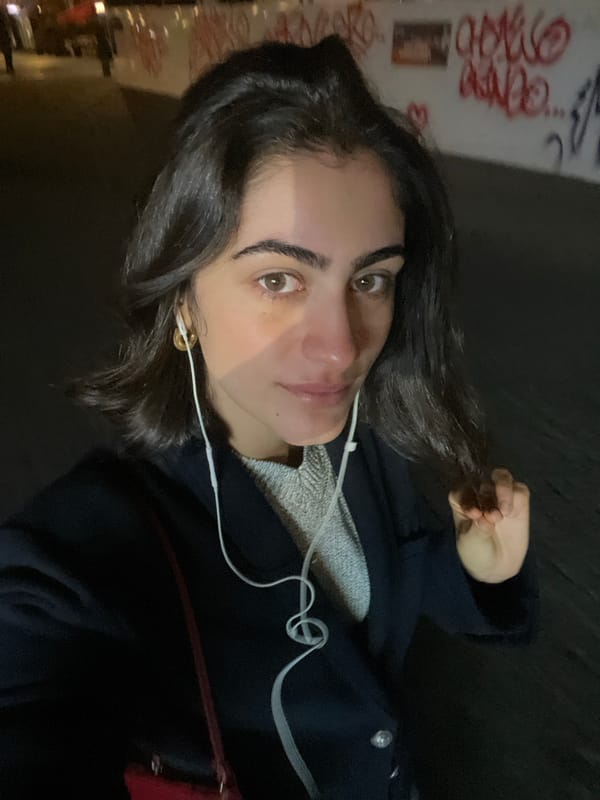 Woman takes late-night selfies near Paris crêperie
