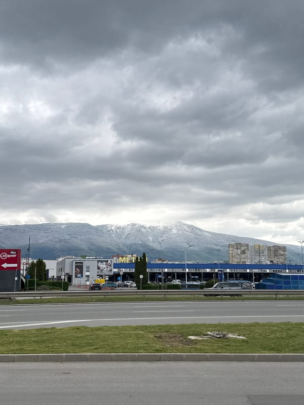 Urban landscape captured in Sofia showing roads, buildings, mountains