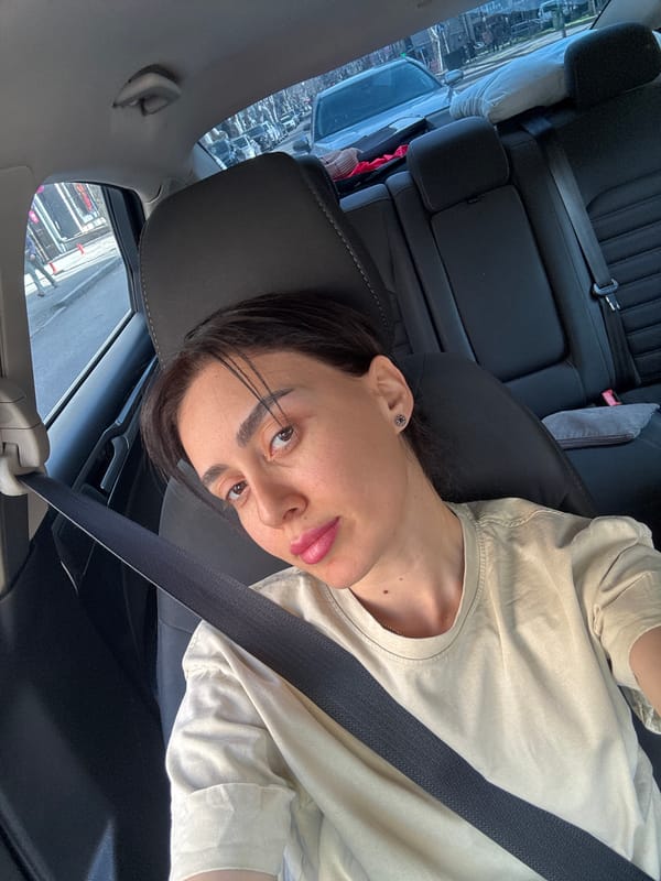 Woman documents car journey through Tbilisi with multiple selfies
