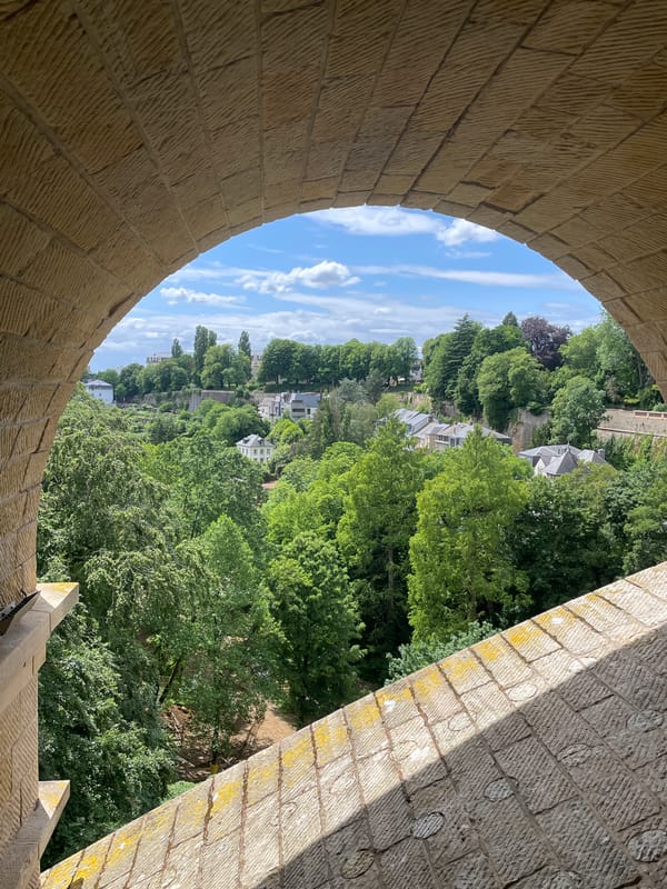 Tourist documents Luxembourg City landmarks during 15-minute walking tour