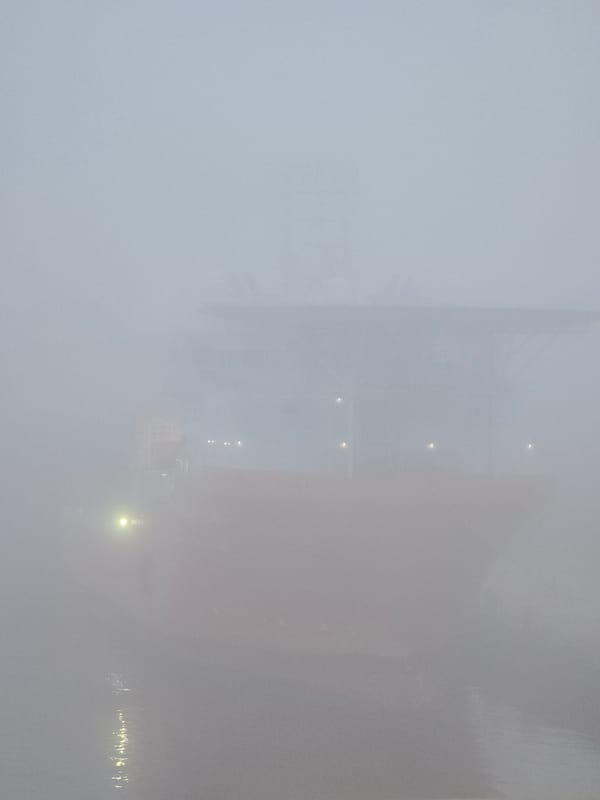 Dense fog shrouds Randaberg Norway coastline early morning