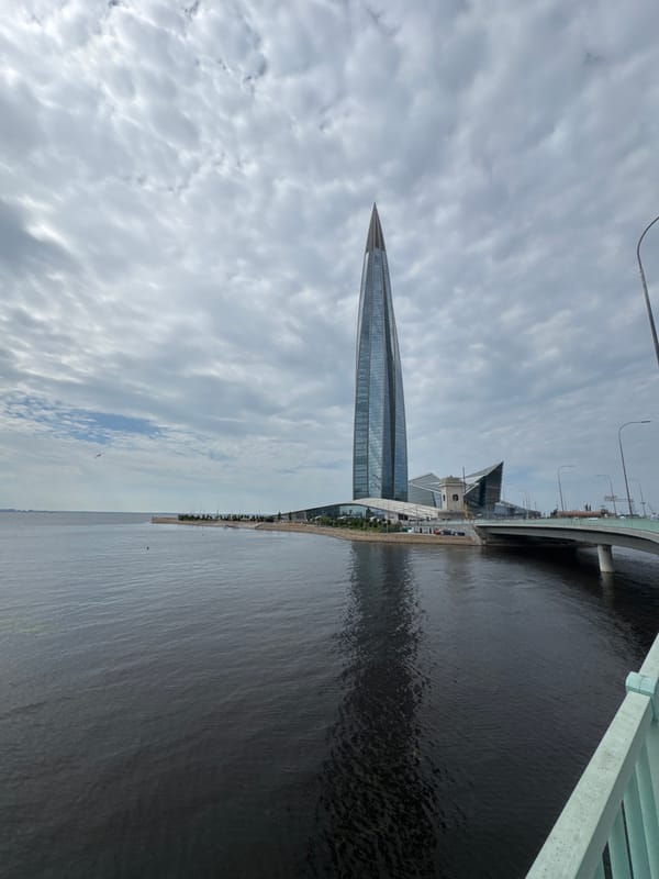 Lakhta Center spire cuts through cloudy Saint Petersburg sky