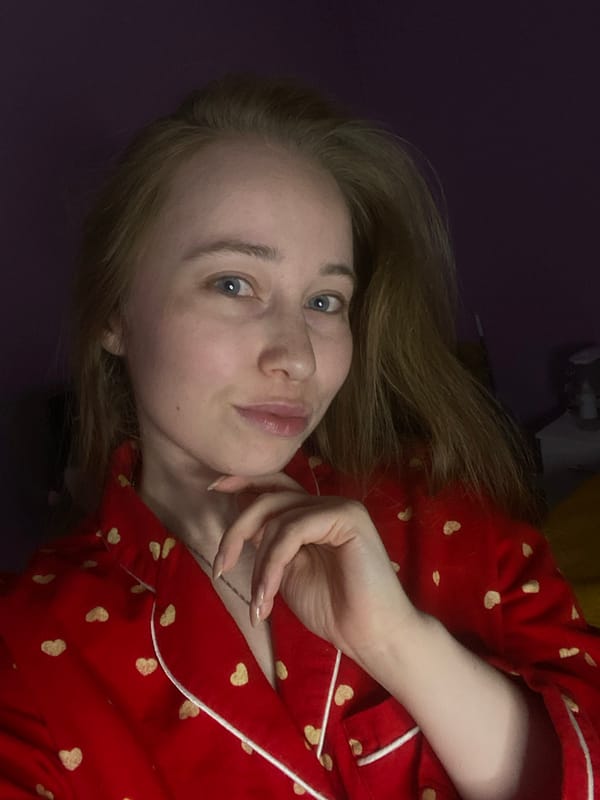 Woman takes evening selfies, dances in Saint Petersburg bedroom