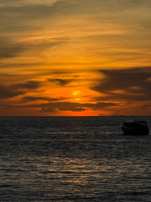 Baan Bang Rak waterfront: piers, boats, and a Gulf sunset