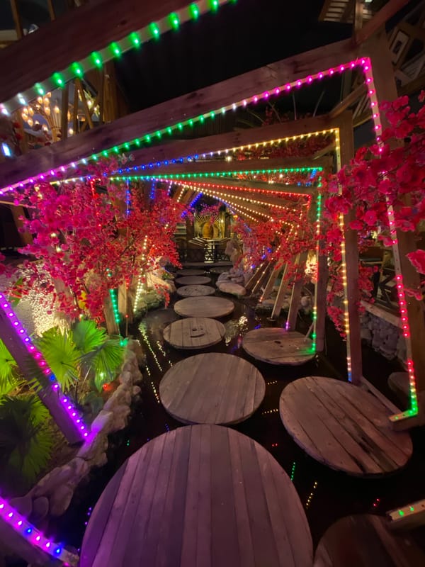 Nha Trang nights: lit-up restaurants, street scooters, and durians
