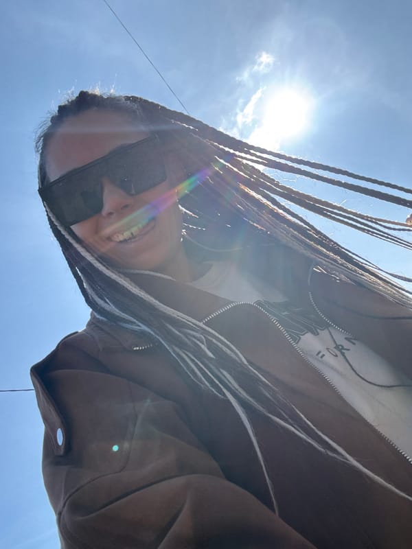 Toddler plays with spider balloon in ball pit
