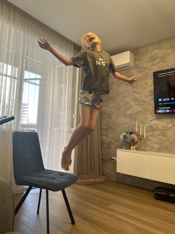 Jumping around a Abakan living room with the cats watching