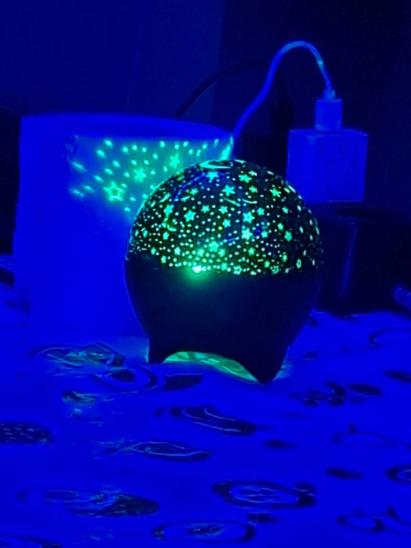 Star projector light show documented in Pleven indoor space