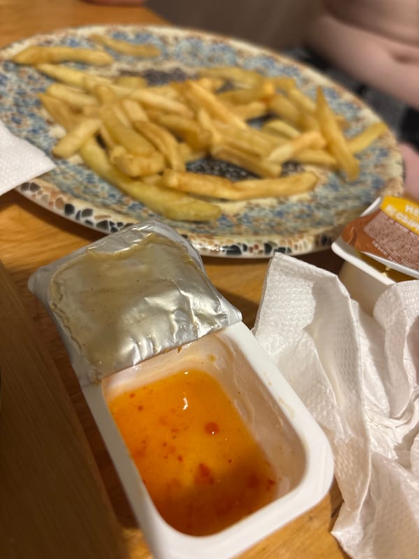 French fries served on patterned plate during casual dining
