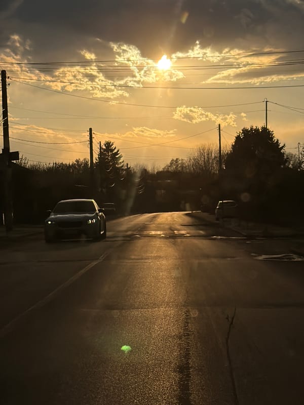 Golden sunset breaks through clouds over Bulgarian village streets