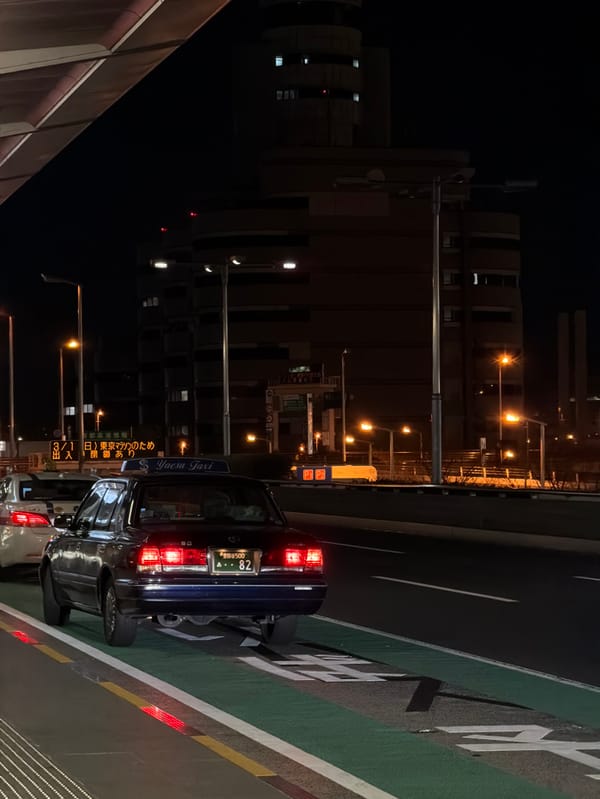 Taxi displays Tokyo Marathon advertisement in Ota, Japan
