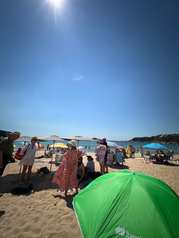 Crowded summer beach day in Sant Feliu de Guíxols