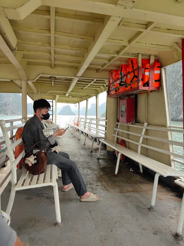 Masked passenger rides ferry in Vietnam's Bai Chay Ward