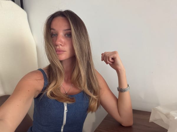 Woman in blue denim outfit observed wearing silver accessories
