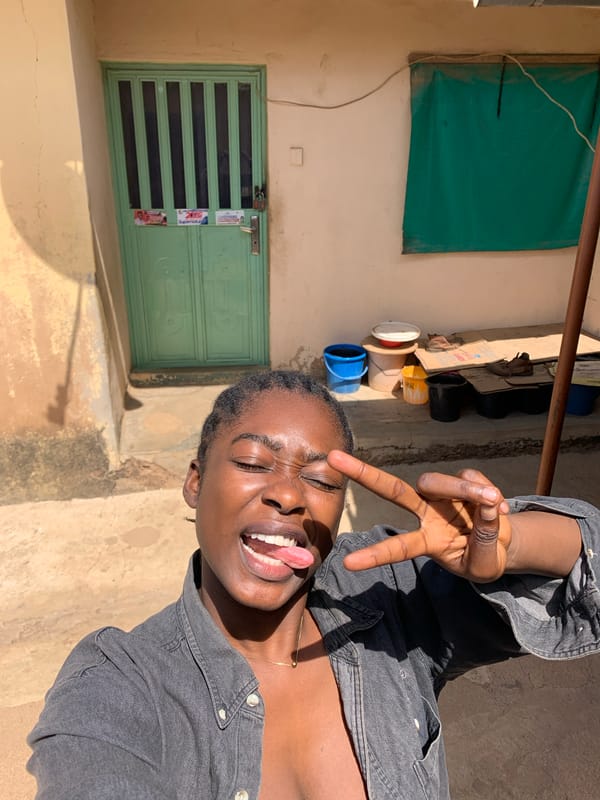 Person photographed posing outside buildings in Rafin Par, Nigeria