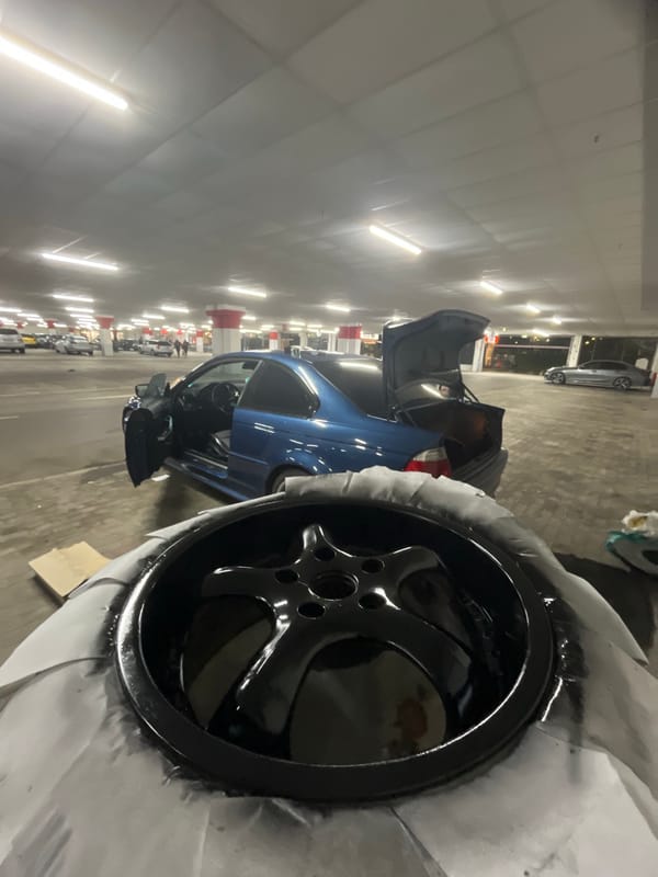 BMW parked with hood open in Varna parking garage