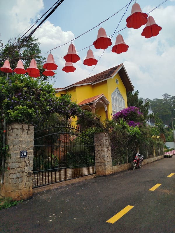Yellow house with red roof documented in Hiep Thanh Vietnam