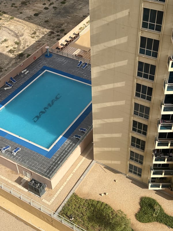 Aerial views capture Dubai residential complex with branded pool