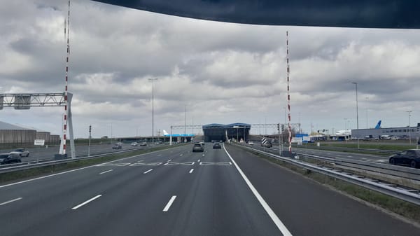 Highway traffic documented near Schiphol airport entrance structure