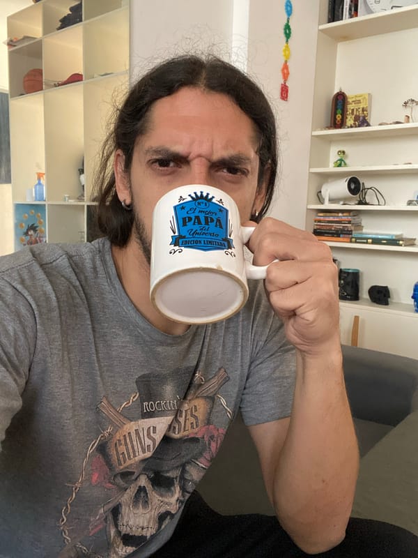 Man holds decorative mug in Buenos Aires