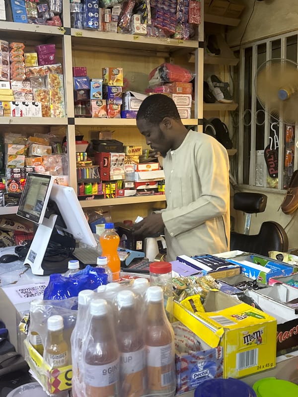 Nighttime street and market life in Abuja, Nigeria