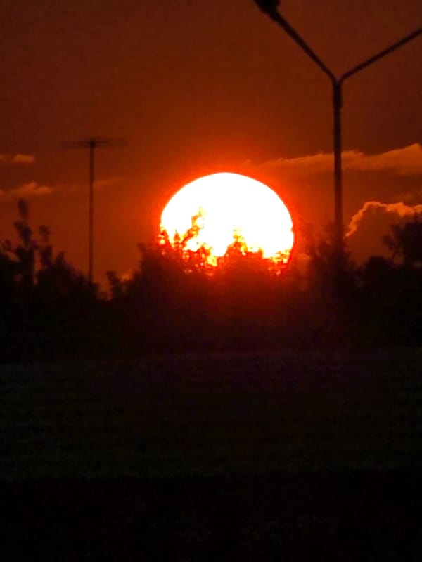Vivid summer sunset over Chelyabinsk streets and parking lots