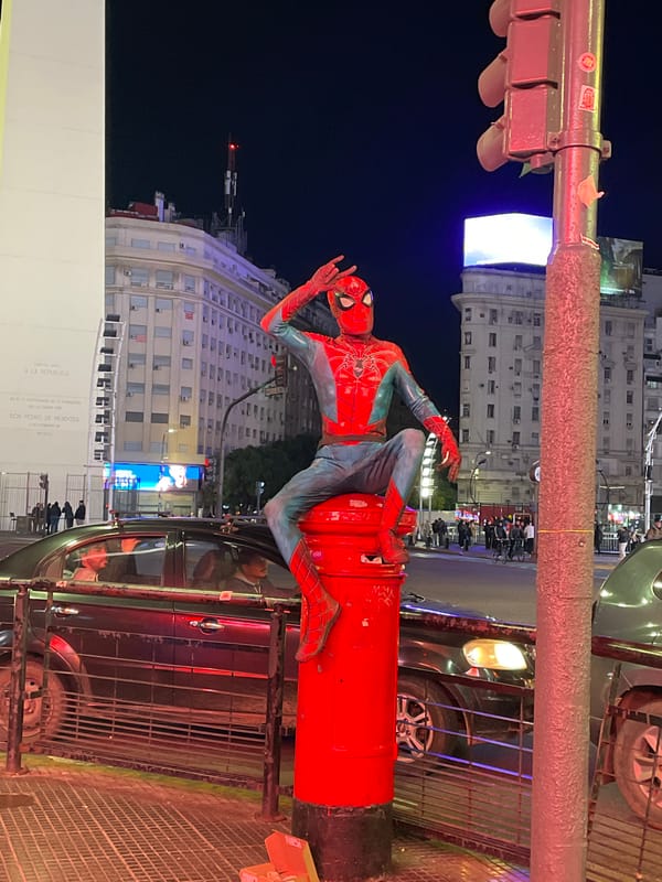 Spider-Man costumed performer spotted on Buenos Aires street fixture