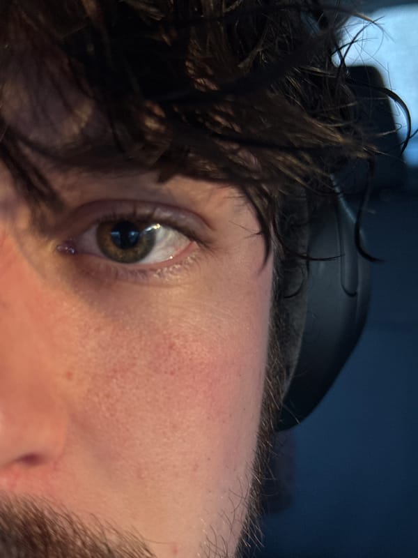 Close-up captures person with visible tear in emotional moment