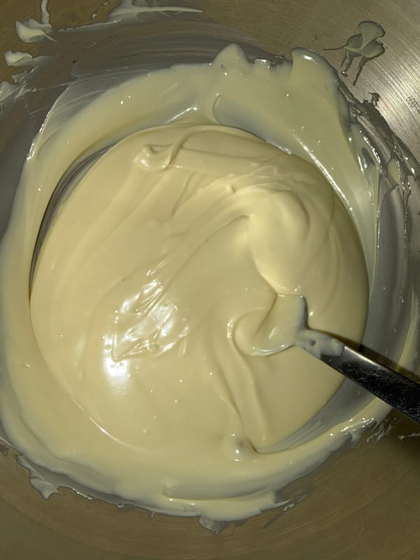 Home baker prepares dessert with chocolate and cream in Strasbourg