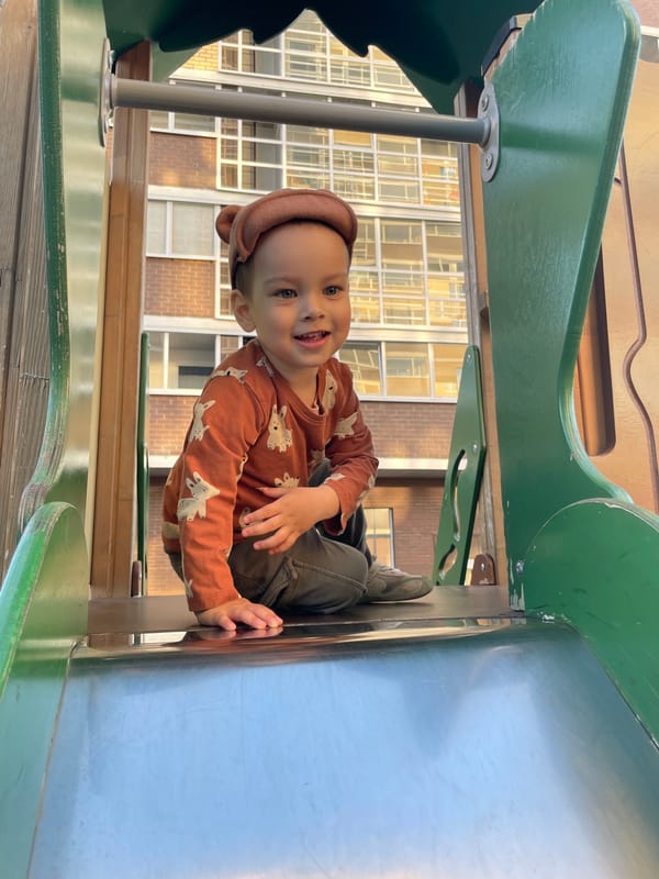 Child plays with toy truck at Izhevsk playground