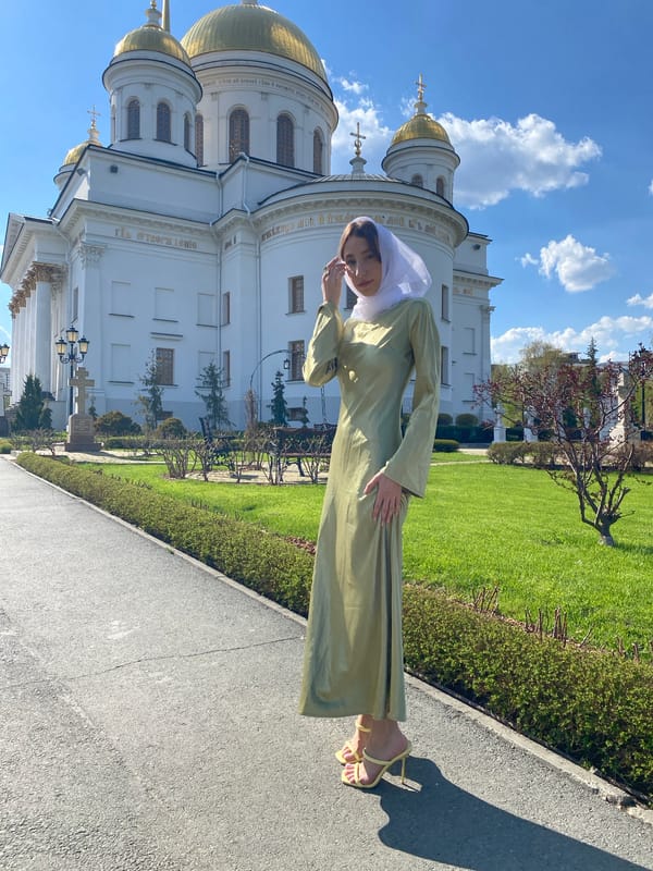 Woman photographs at Church on Blood in Yekaterinburg