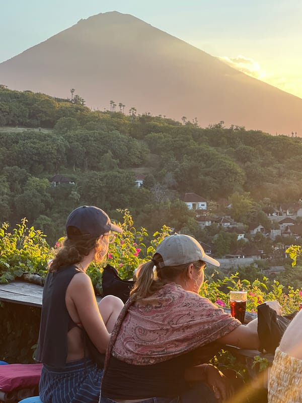 Sunset drinks and views at a hilltop deck near Mount Agung