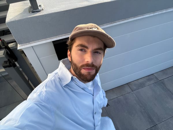 Man on rooftop balcony with outdoor kitchen in Laval