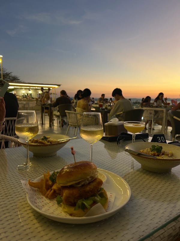 Outdoor dining scene captured at seaside restaurant in Thailand