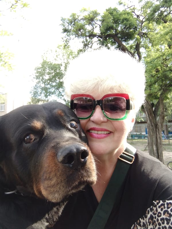 Woman and Rottweiler enjoy morning playtime in Ukrainian city