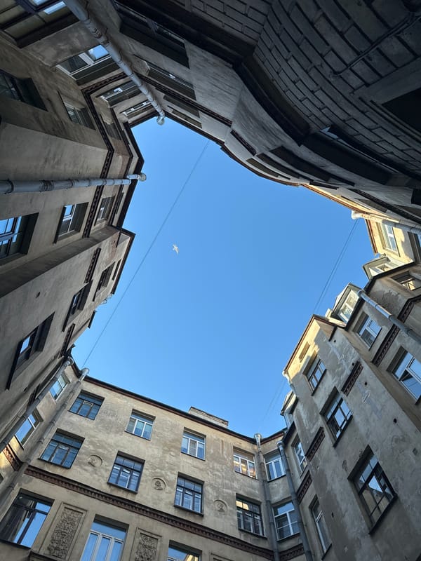 Urban architecture and cafe life documented in unnamed city