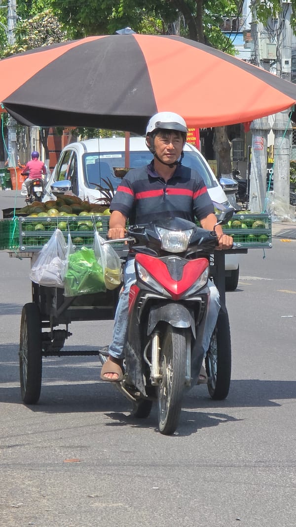 Morning motorcycle commute scenes captured across Nha Trang streets