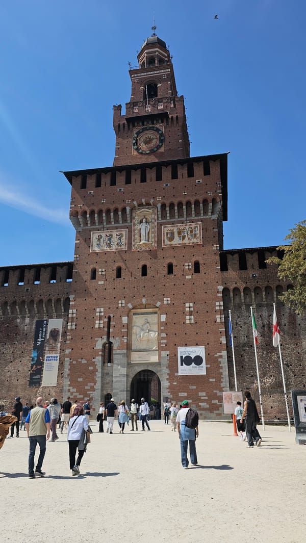 Tourists gather at Milan's historic Sforza Castle Saturday afternoon