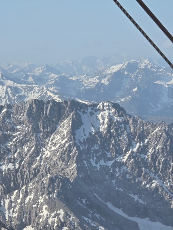 Cable car riders document Alpine views near Grainau, Germany