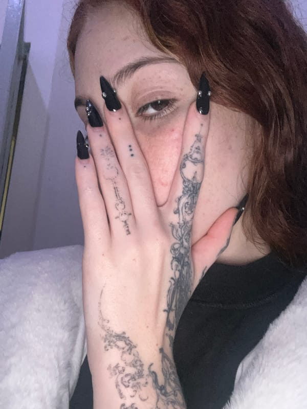 Cozy night in: cat, penguin, tattoos, and pajamas
