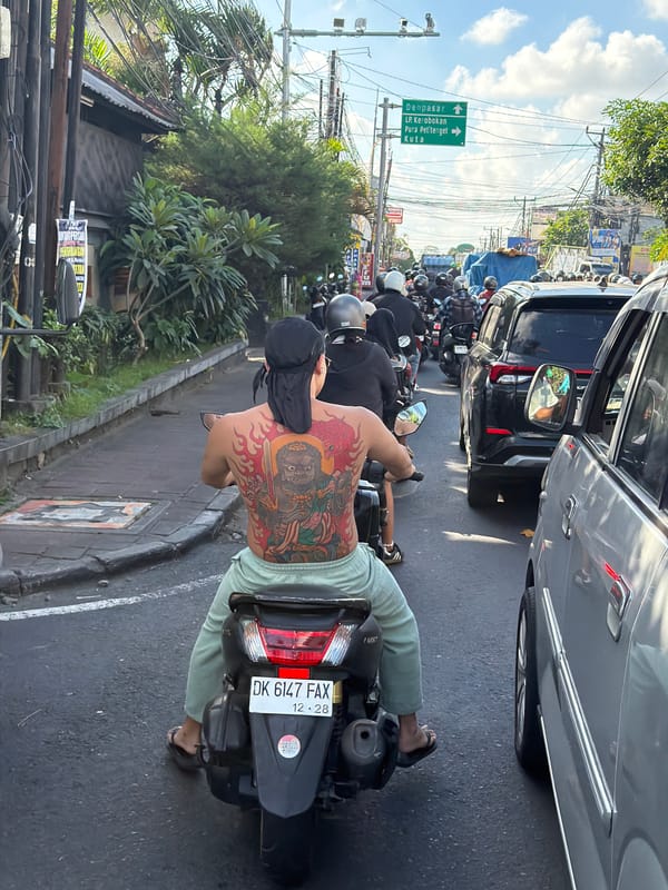 Slow traffic on a congested North Kuta street