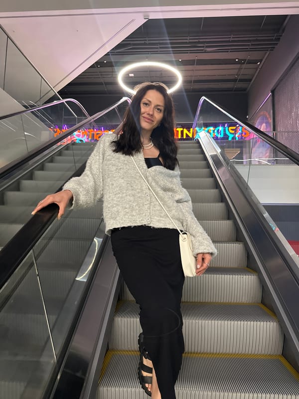Woman observed using escalator in Murino building