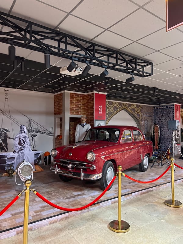Vintage red car displayed at Tashkent museum exhibit