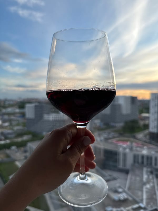 Evening wine moment captured against Lyubertsy sunset skyline