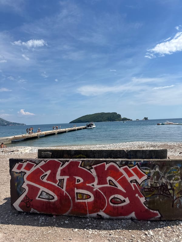 Adriatic pier and rocky beach documented in Budva, Montenegro