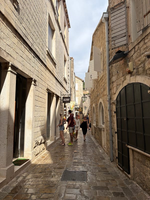 Summer morning in Budva's Old Town — streets, bars, and cafes